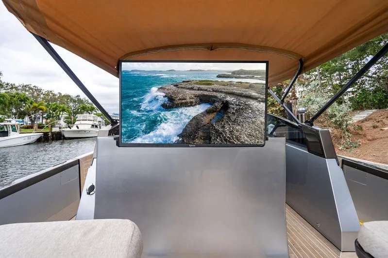  Yacht Photos Pics Luxury CNM 43 Continental yacht interior with scenic ocean view on screen, 2015 model.