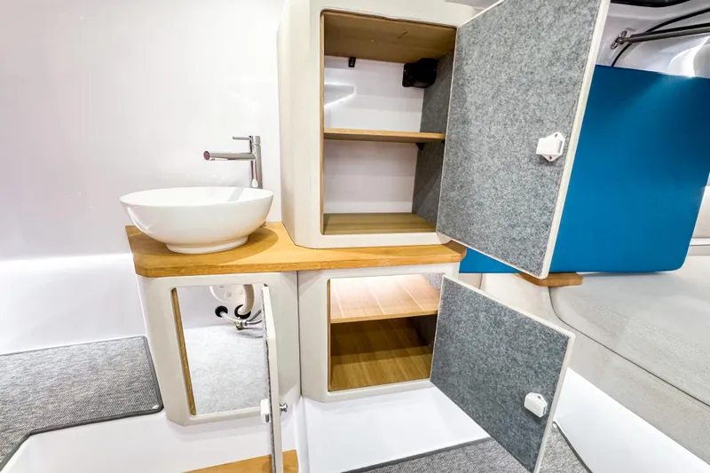  Yacht Photos Pics Modern interior of 2025 Axopar 37 Sun Top BRABUS Trim with stylish sink and storage.