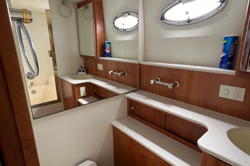 Sunflower Yacht Photos Pics Luxurious bathroom in 2002 Silverton 453 Motor Yacht with wood accents and modern fixtures.