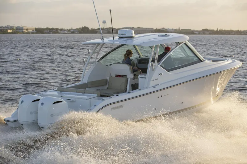  Yacht Photos Pics Manufacturer Provided Image: 2017 Pursuit DC 295 Dual Console boat cruising on the water.