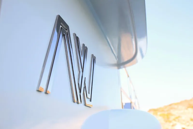  Yacht Photos Pics Close-up of Ada Yacht Steel Trawler 2014 with sleek metallic logo.