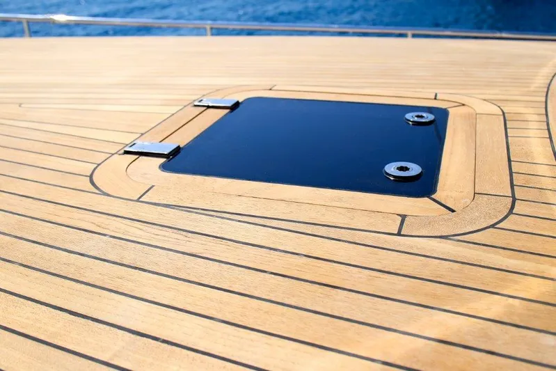  Yacht Photos Pics Teak deck of 2014 Ada Yacht Steel Trawler with a hatch, overlooking the sea.