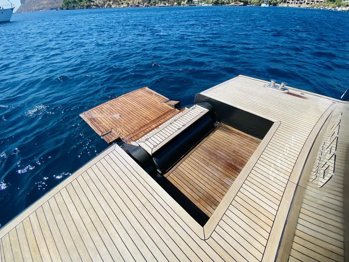  Yacht Photos Pics Ada Yacht Steel Trawler 2014 with wooden deck and swim platform on blue ocean water.