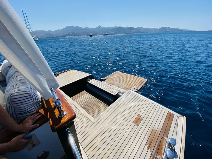  Yacht Photos Pics Ada Yacht Steel Trawler 2014 on serene blue waters with distant mountains.