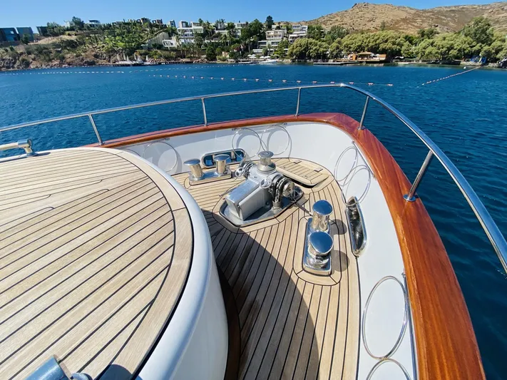  Yacht Photos Pics Bow of 2014 Ada Yacht Steel Trawler with teak deck, anchored in scenic bay.