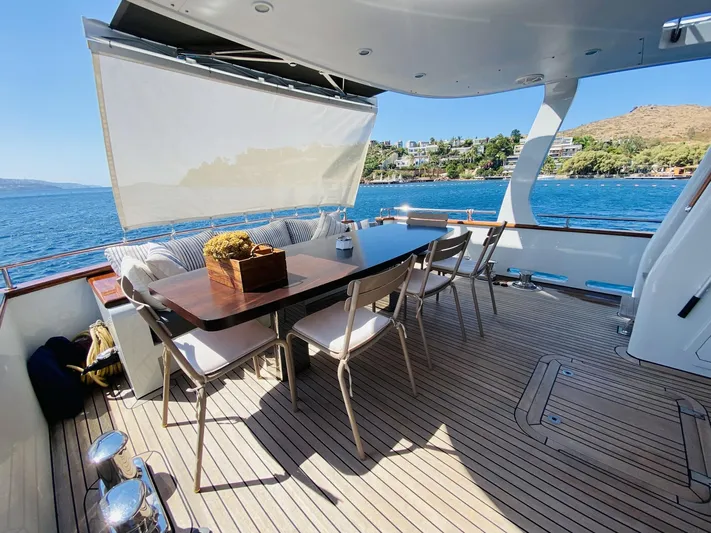  Yacht Photos Pics Outdoor dining area on 2014 Ada Yacht Steel Trawler, overlooking scenic waterfront views.