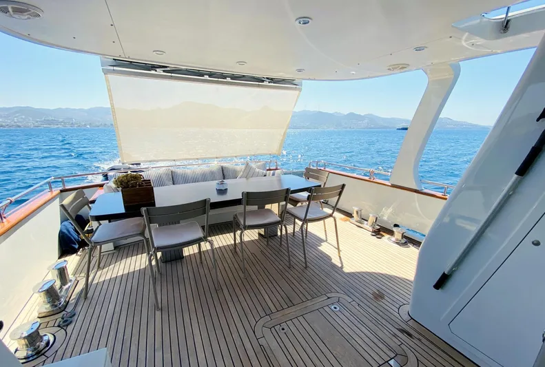  Yacht Photos Pics Luxurious 2014 Ada Yacht Steel Trawler deck with seating, overlooking serene ocean and mountains.