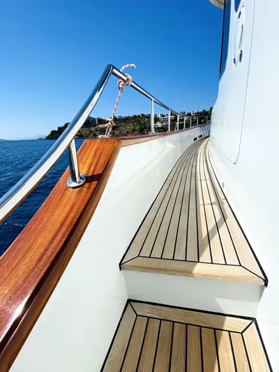  Yacht Photos Pics Ada Yacht Steel Trawler 2014, elegant wooden deck, clear blue sky, ocean view.