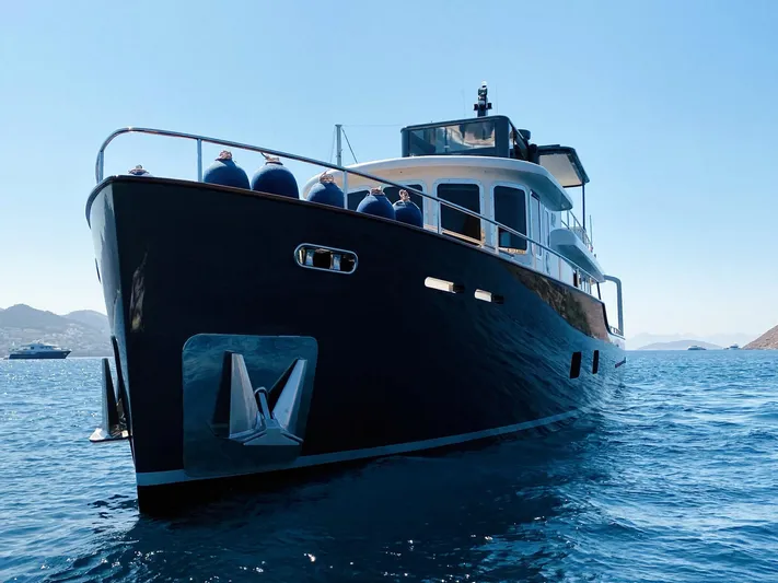  Yacht Photos Pics 2014 Ada Yacht Steel Trawler on calm sea, showcasing sleek design and sturdy build.