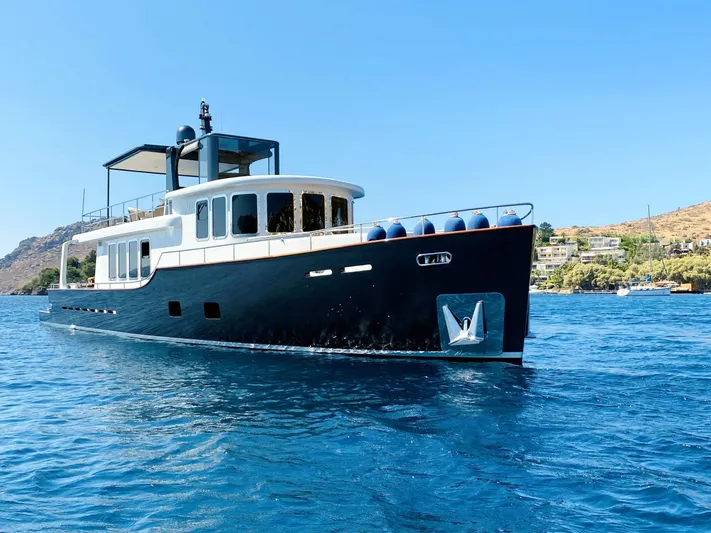  Yacht Photos Pics Ada Yacht Steel Trawler 2014 cruising on blue waters under clear skies.