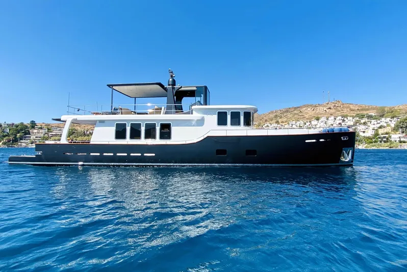  Yacht Photos Pics Ada Yacht Steel Trawler 2014 on calm blue water with clear sky background.