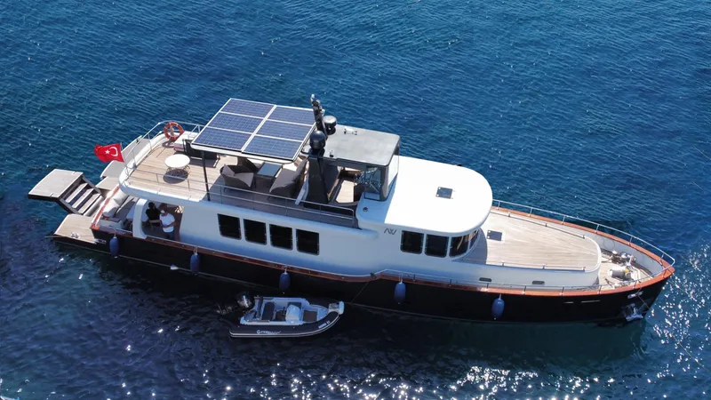  Yacht Photos Pics Ada Yacht Steel Trawler 2014 with solar panels, cruising in clear blue waters.