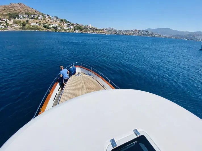  Yacht Photos Pics Ada Yacht Steel Trawler 2014 cruising on blue waters near scenic coastline.