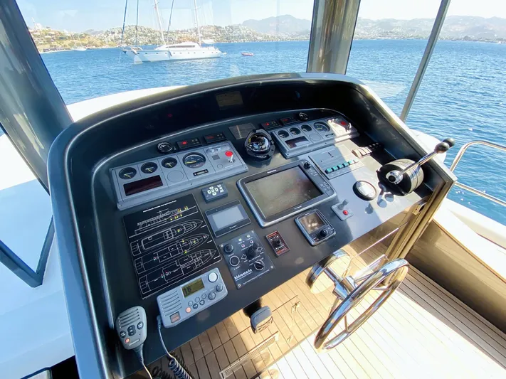  Yacht Photos Pics Control panel of a 2014 Ada Yacht Steel Trawler, overlooking a scenic ocean view.