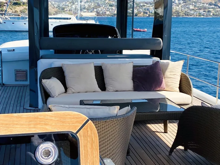  Yacht Photos Pics Luxurious seating area on 2014 Ada Yacht Steel Trawler, overlooking serene blue waters.