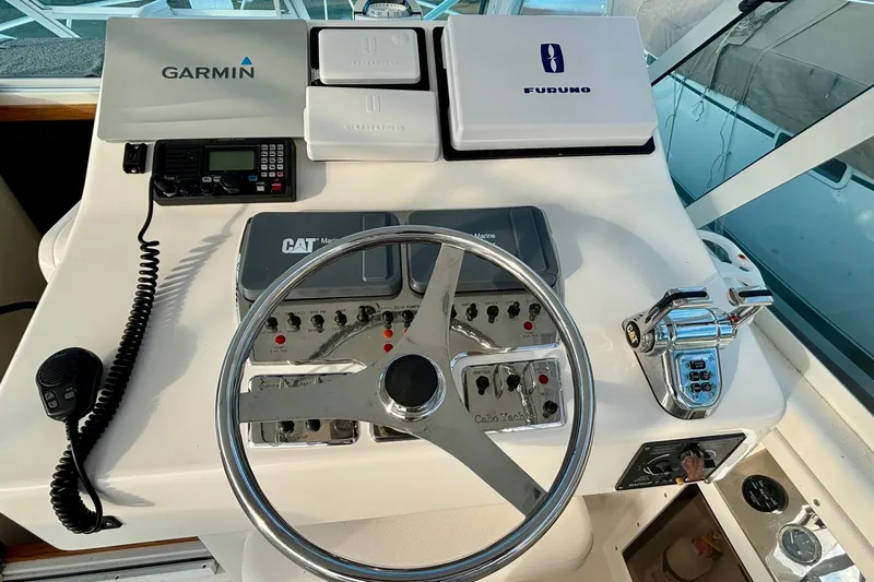 Niala Yacht Photos Pics Helm of 2004 Cabo 35 Express Sportfish with Garmin and Furuno equipment.