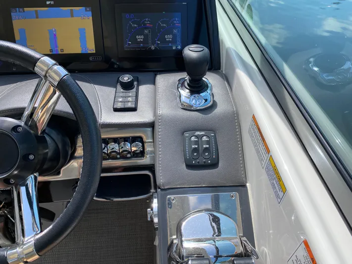 Lady Bird 2 Yacht Photos Pics 2021 Formula 310 Bowrider I/O dashboard with steering wheel and control panel.