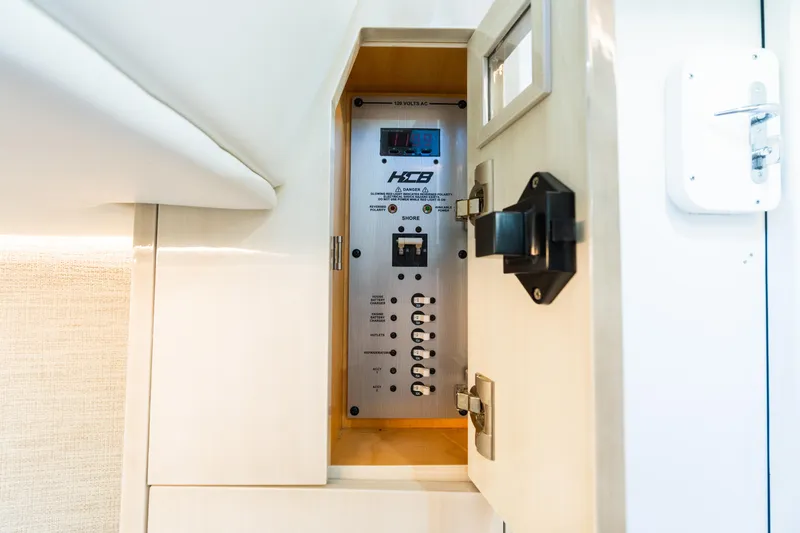  Yacht Photos Pics Electrical panel inside 2023 HCB 42 Lujo boat, showcasing control switches and display.