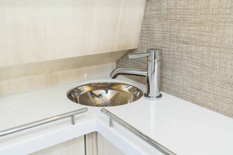  Yacht Photos Pics Luxury yacht HCB 42 Lujo 2023 interior sink with modern chrome faucet.