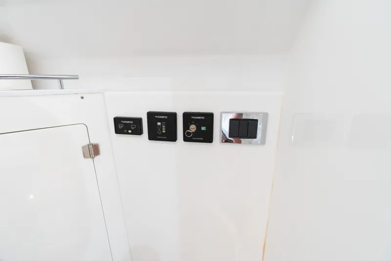  Yacht Photos Pics Control panel on 2023 HCB 42 Lujo boat interior, featuring Dometic switches.