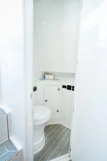  Yacht Photos Pics 2023 HCB 42 Lujo boat bathroom with modern white interior and compact design.