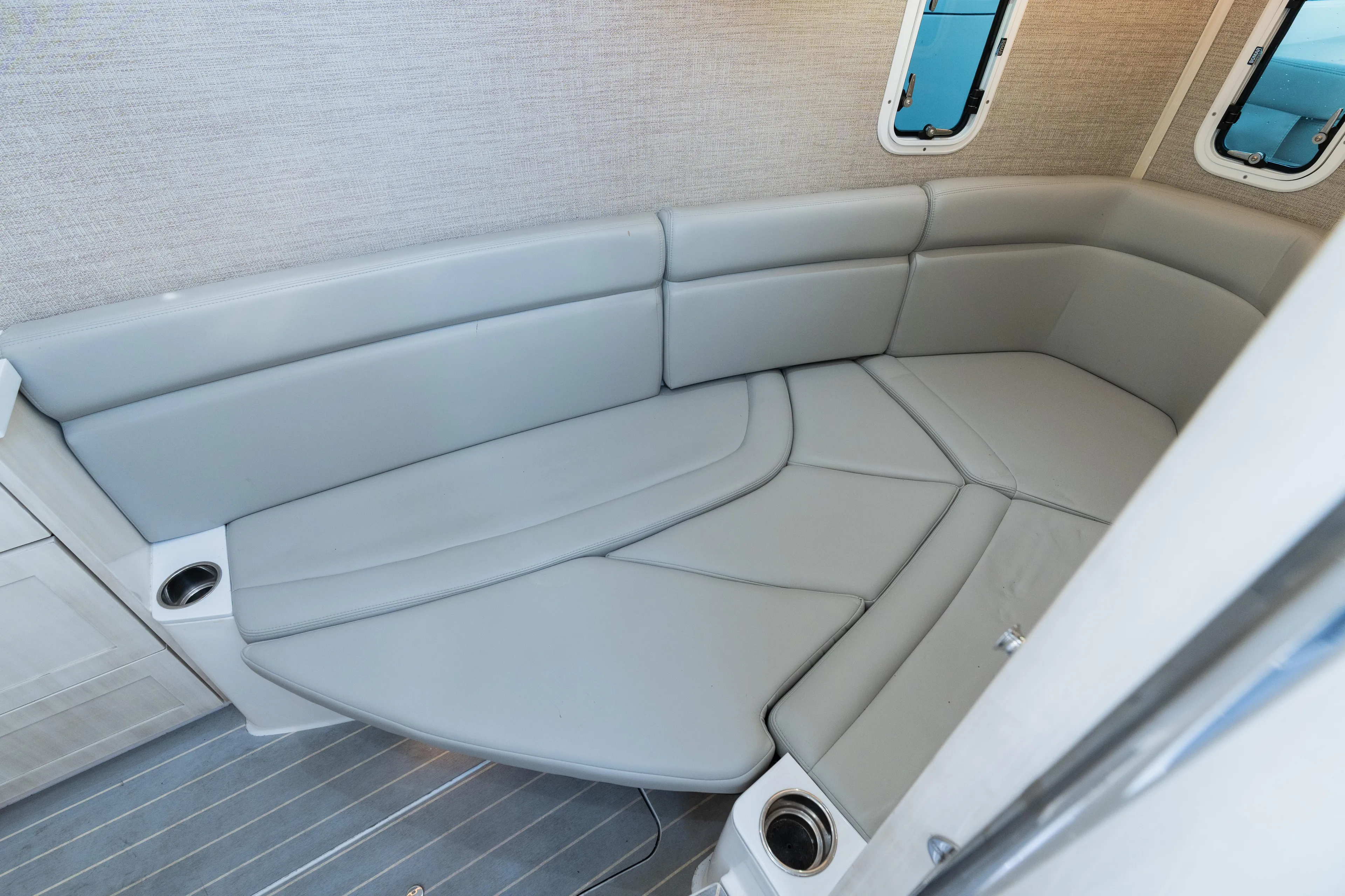  Yacht Photos Pics Luxurious interior seating of 2023 HCB 42 Lujo boat with gray upholstery.