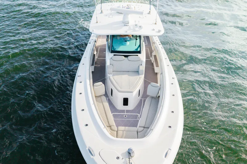  Yacht Photos Pics 2023 HCB 42 Lujo boat on water, aerial view showcasing sleek design and spacious deck.