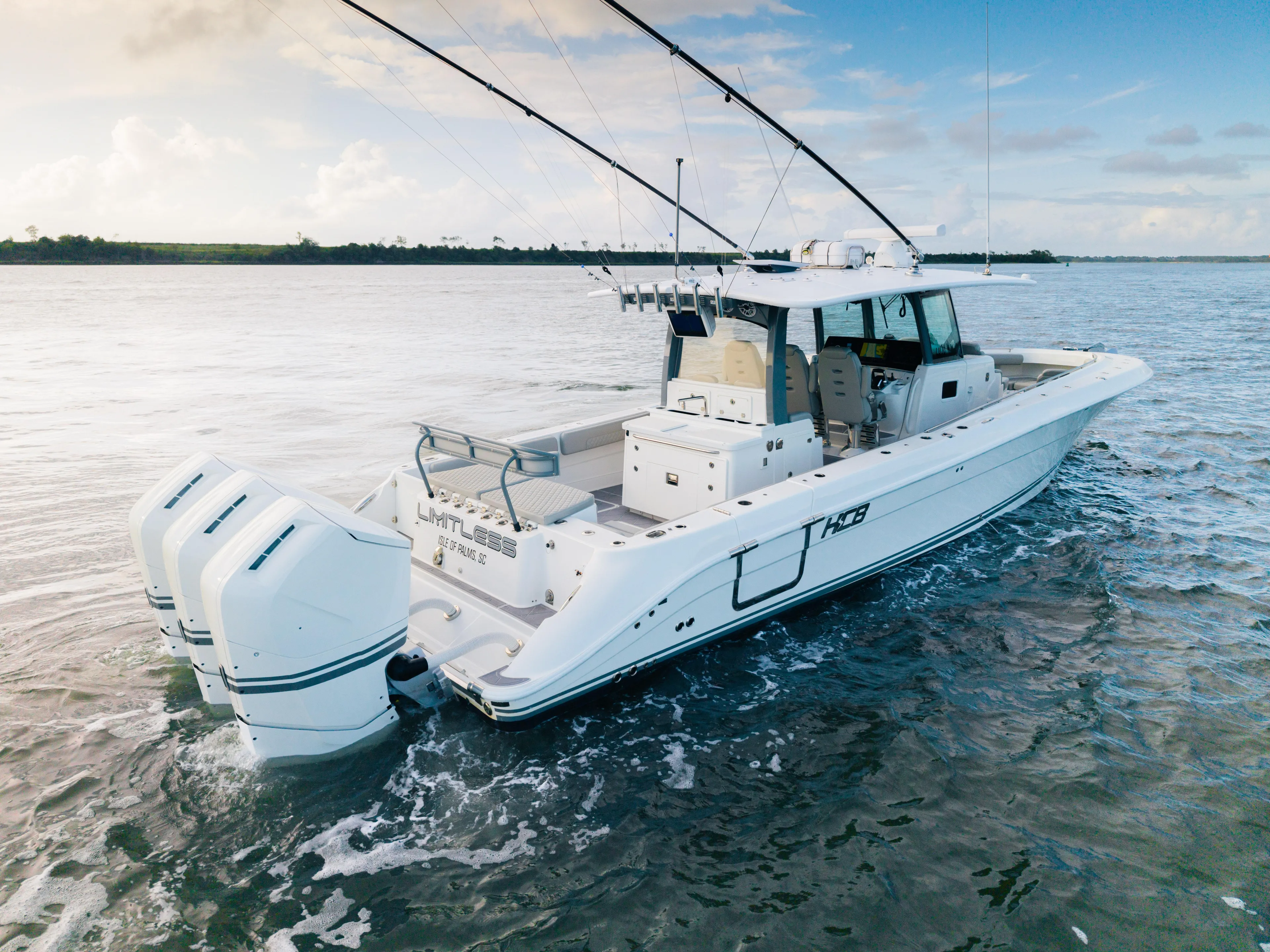  Yacht Photos Pics 2023 HCB 42 Lujo boat on water, featuring triple outboard engines.