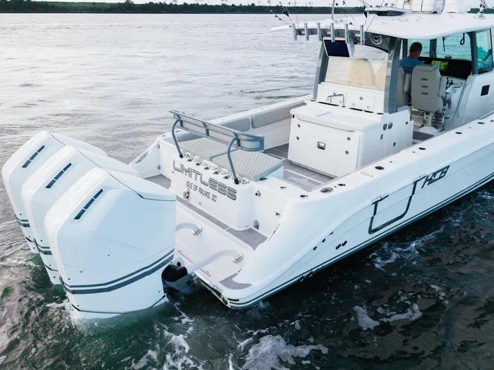  Yacht Photos Pics 2023 HCB 42 Lujo boat with triple engines cruising on water.