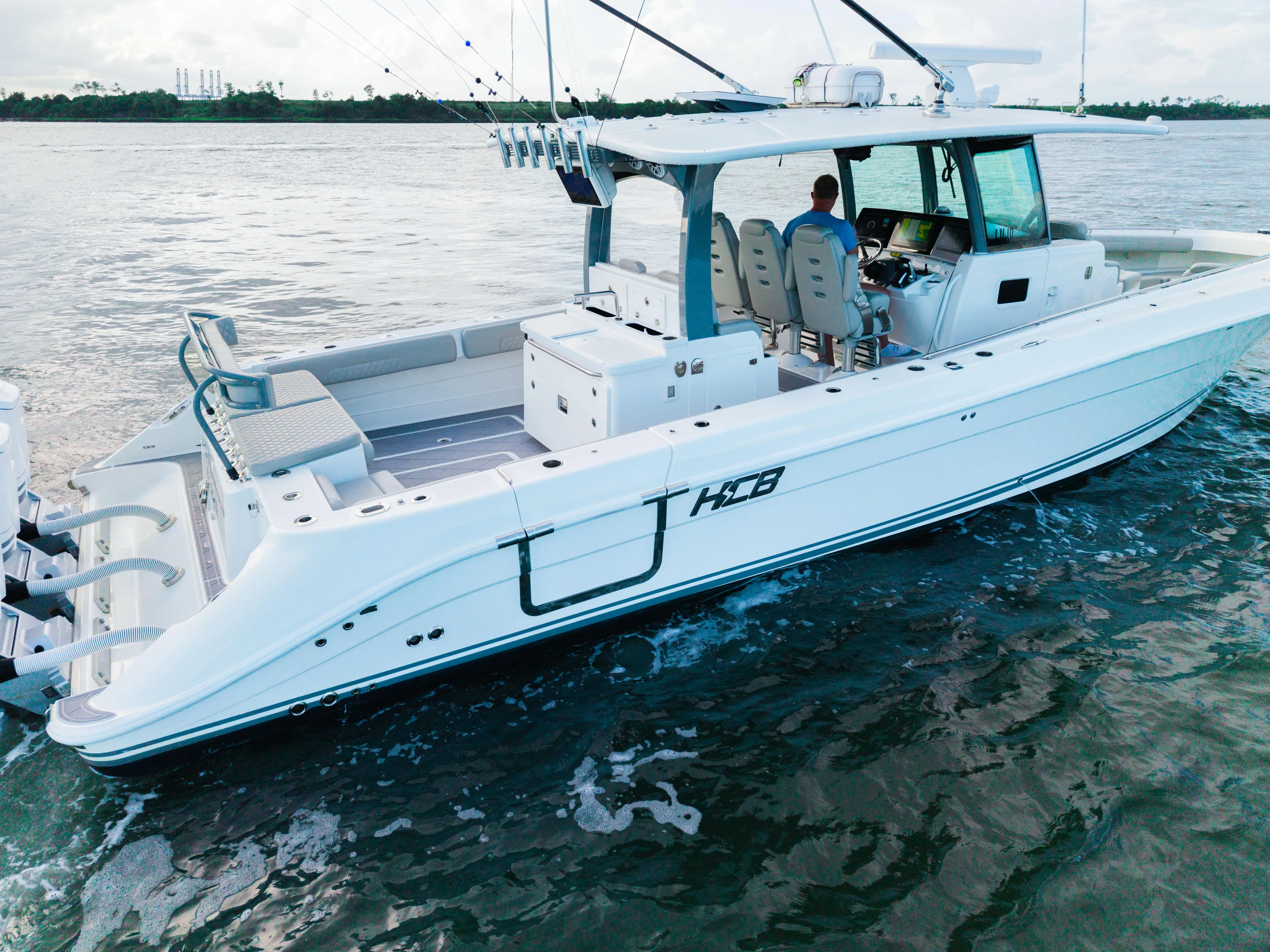  Yacht Photos Pics 2023 HCB 42 Lujo boat on water, featuring spacious deck and modern design.