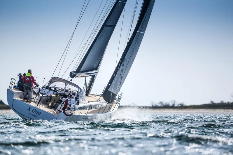  Yacht Photos Pics 2025 X-Yachts X4⁶ sailing on open water with crew onboard.