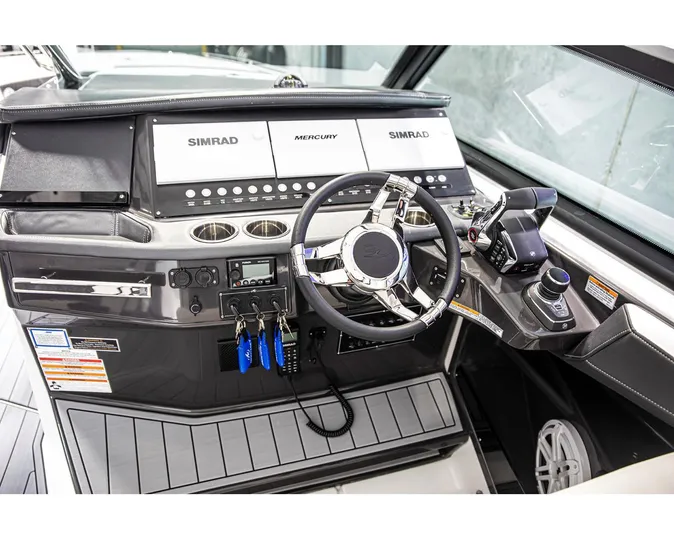  Yacht Photos Pics 2022 Monterey 38 Super Sport boat dashboard with Simrad and Mercury controls.