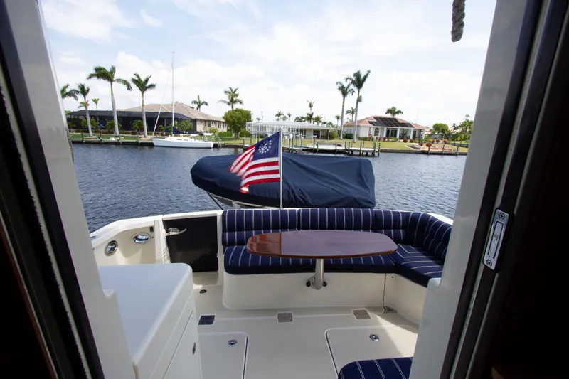 Starlight Yacht Photos Pics 2010 Sabre 40 Hardback Express yacht with rear deck seating and American flag.