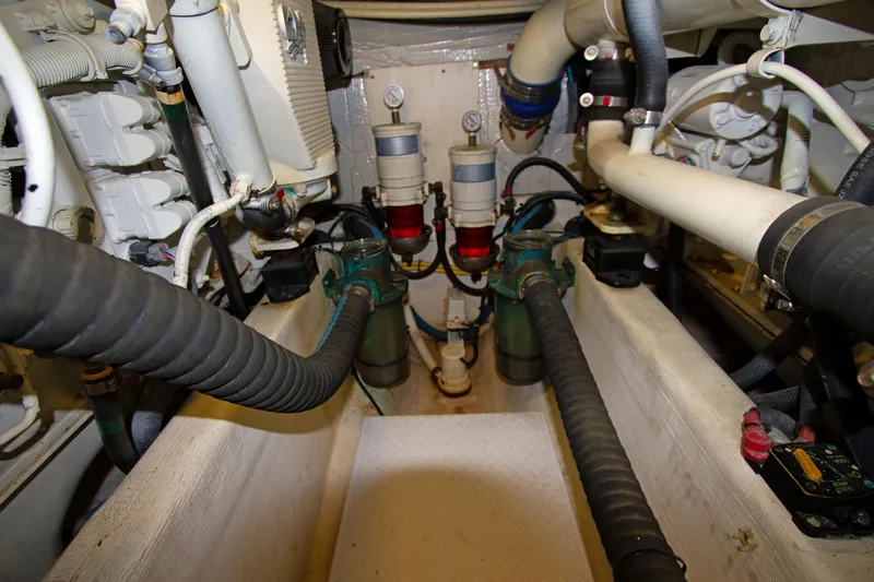 Starlight Yacht Photos Pics Engine room of a 2010 Sabre 40 Hardback Express boat showing hoses and filters.