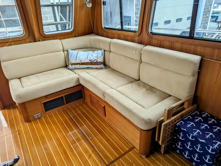  Yacht Photos Pics Interior of 2003 Sabre 36 Flybridge with beige seating and nautical decor.
