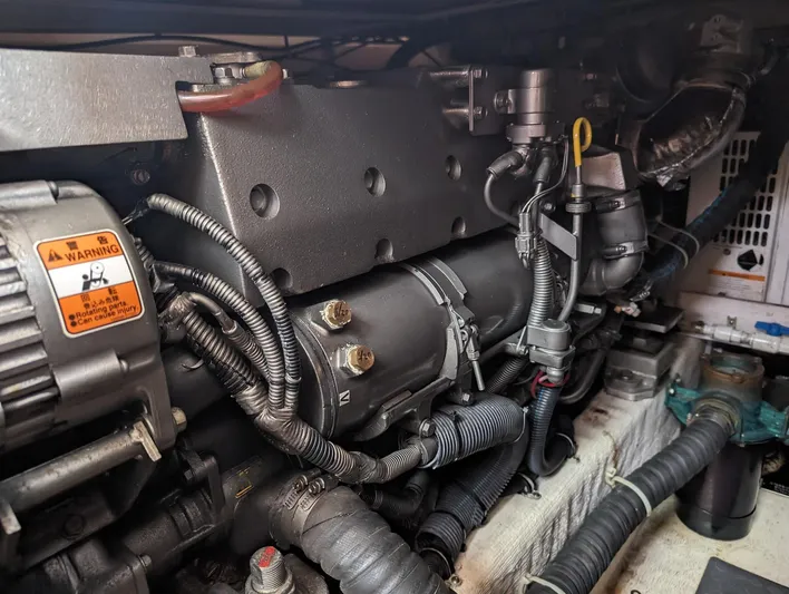  Yacht Photos Pics Engine compartment of a 2003 Sabre 36 Flybridge boat, showcasing mechanical components.