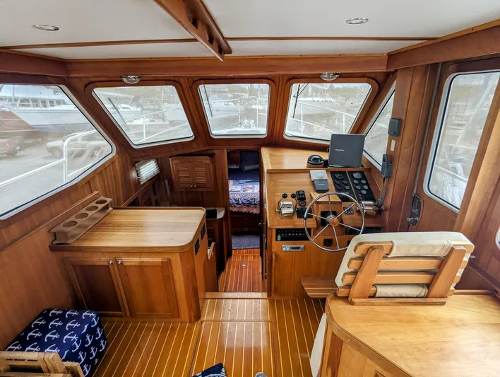  Yacht Photos Pics Interior of 2003 Sabre 36 Flybridge yacht with wooden finish and navigation equipment.