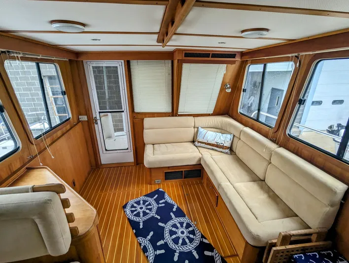  Yacht Photos Pics Interior of 2003 Sabre 36 Flybridge with beige seating and nautical-themed decor.
