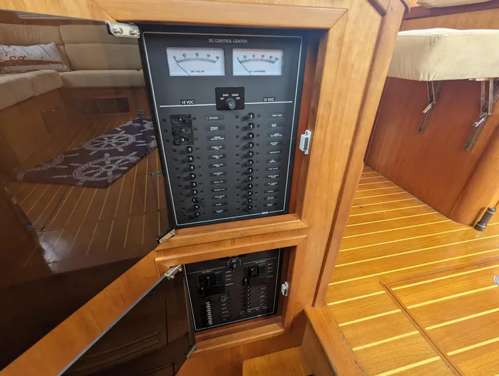  Yacht Photos Pics Electrical panel on 2003 Sabre 36 Flybridge yacht, featuring wood interior and control gauges.