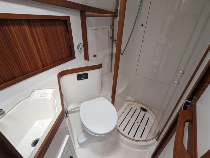  Yacht Photos Pics 2003 Sabre 36 Flybridge bathroom with shower, toilet, and sink.