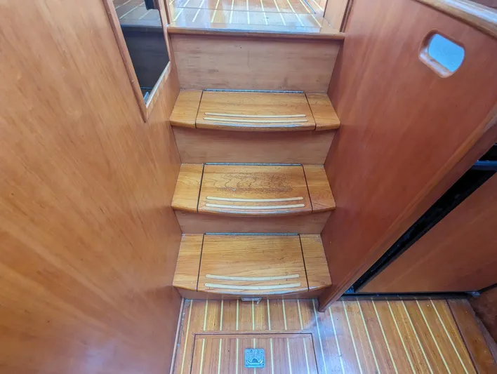  Yacht Photos Pics Wooden stairs inside 2003 Sabre 36 Flybridge yacht, featuring elegant design and craftsmanship.
