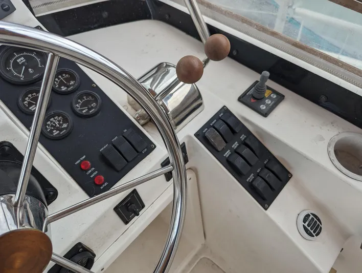  Yacht Photos Pics 2003 Sabre 36 Flybridge helm with steering wheel, gauges, and control panel.