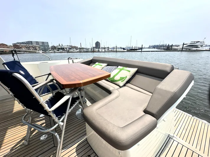 Grand Cru Yacht Photos Pics Luxury seating area on 2017 Prestige 500 S yacht with marina view.