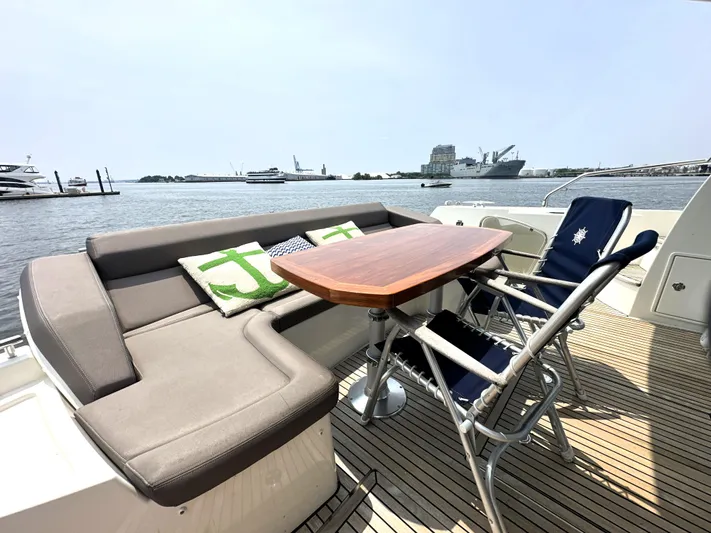 Grand Cru Yacht Photos Pics Luxurious 2017 Prestige 500 S yacht deck with seating, table, and ocean view.