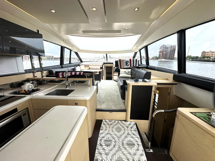 Grand Cru Yacht Photos Pics Luxurious interior of a 2017 Prestige 500 S yacht with modern amenities and waterfront view.