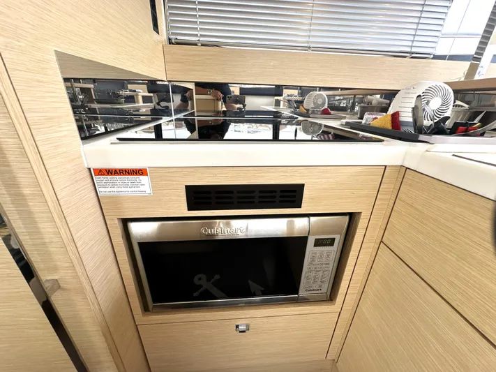 Grand Cru Yacht Photos Pics Modern kitchen area in a 2017 Prestige 500 S yacht with built-in appliances.