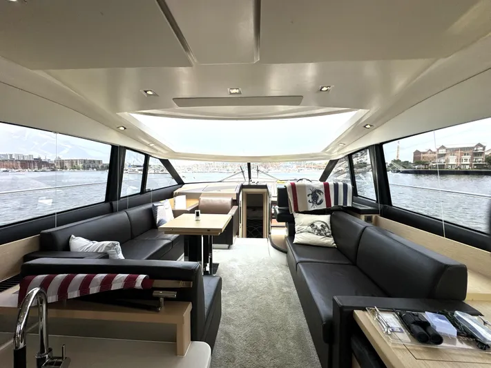 Grand Cru Yacht Photos Pics Luxurious interior of a 2017 Prestige 500 S yacht with panoramic windows.