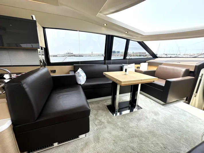 Grand Cru Yacht Photos Pics Luxurious interior of a 2017 Prestige 500 S yacht with modern seating and table.