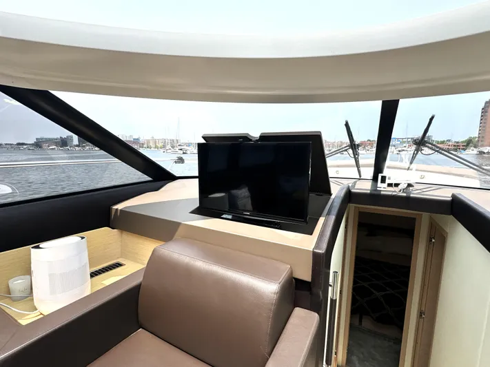 Grand Cru Yacht Photos Pics Luxurious interior of 2017 Prestige 500 S yacht with TV and leather seating.