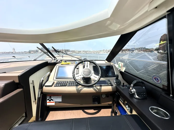 Grand Cru Yacht Photos Pics Cockpit of 2017 Prestige 500 S yacht with modern navigation equipment and steering wheel.